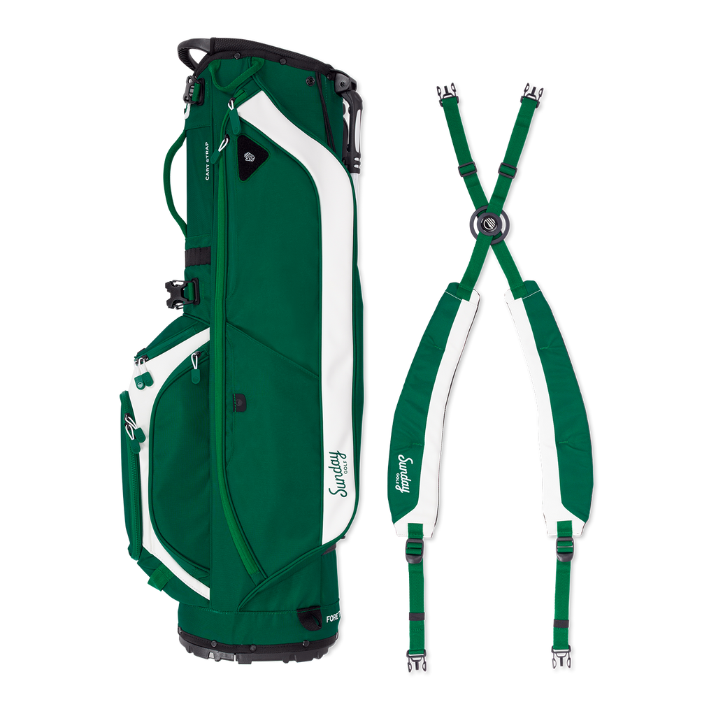 A full shot of Ryder golf bag in evergreen laying flat sideways beside its double strap
