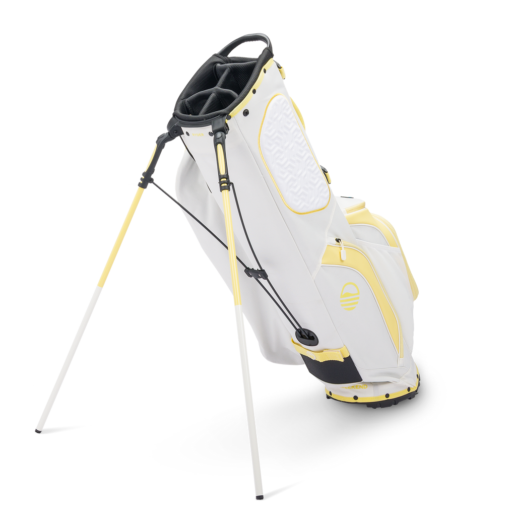 A full shot of standing Ryder golf bag in mindy lemon facing backward
