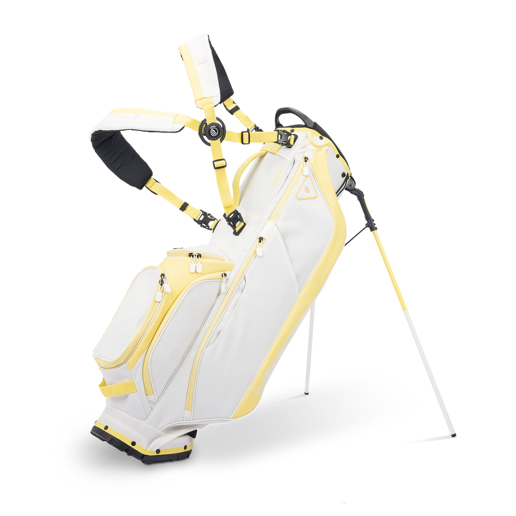 A full front shot of standing Ryder golf bag in mindy lemon with double strap