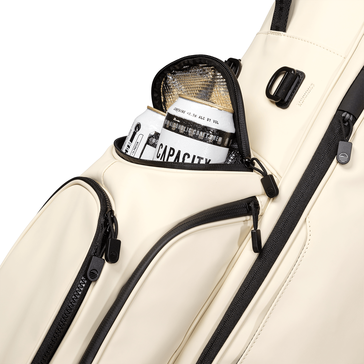 A close up shot of cream vegan leather Ryder S-Class golf bag's frosty pocket with canned drinks inside