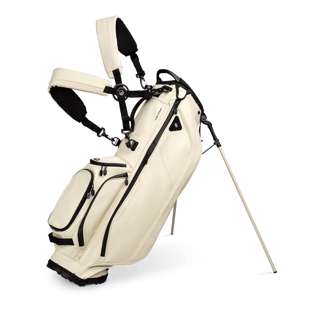 A full front shot of standing Ryder S-Class golf bag in cream vegan leather with double strap