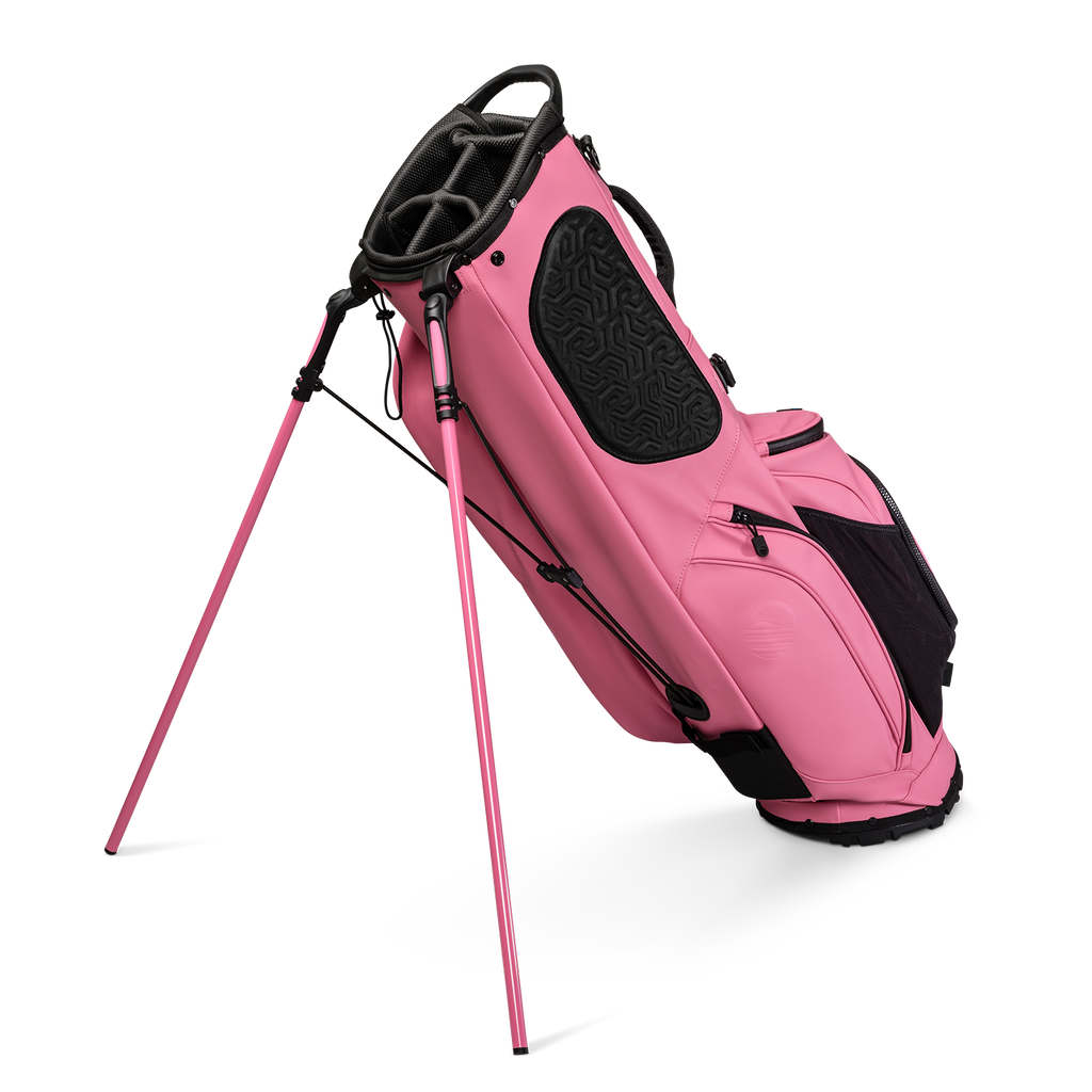 A full shot of standing Ryder S-Class golf bag in dusty pink vegan leather facing backward
