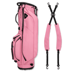 A full shot of Ryder S-Class golf bag in dusty pink vegan leather laying flat sideways beside its double strap