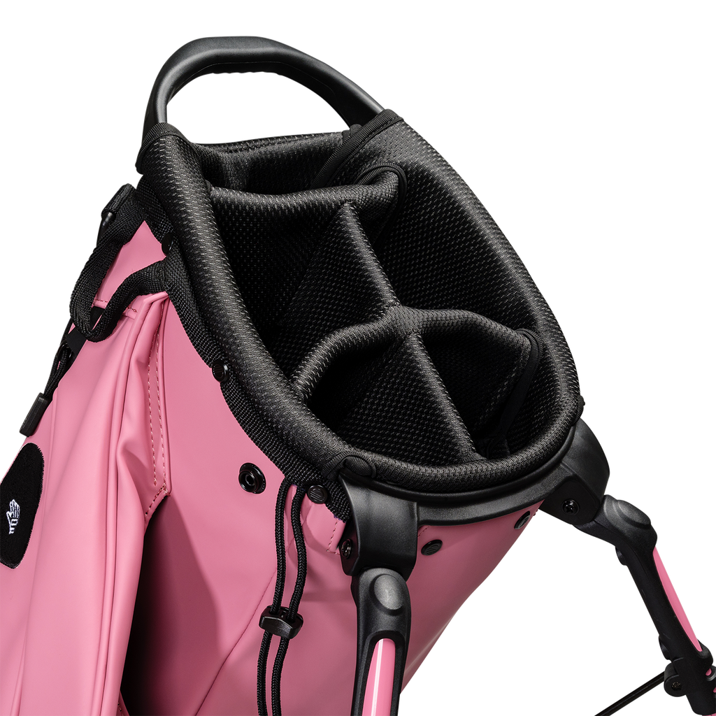 A close up top view of a dusty pink vegan leather Ryder S-Class golf bag’s 5-way divider