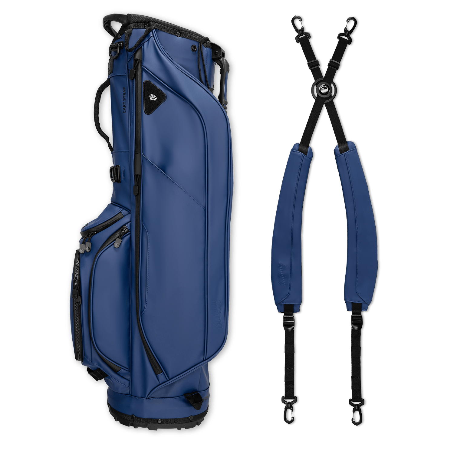 A full shot of Ryder S-Class golf bag in navy vegan leather laying flat sideways beside its double strap