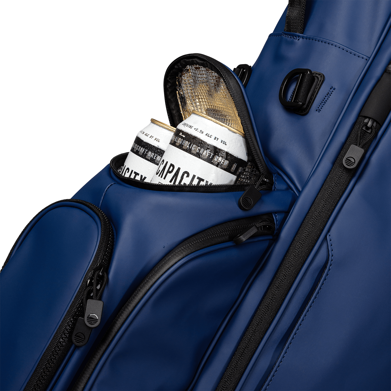 A close up shot of navy vegan leather Ryder S-Class golf bag's frosty pocket with canned drinks inside