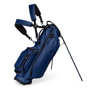 A full front shot of standing Ryder S-Class golf bag in navy vegan leather with double strap