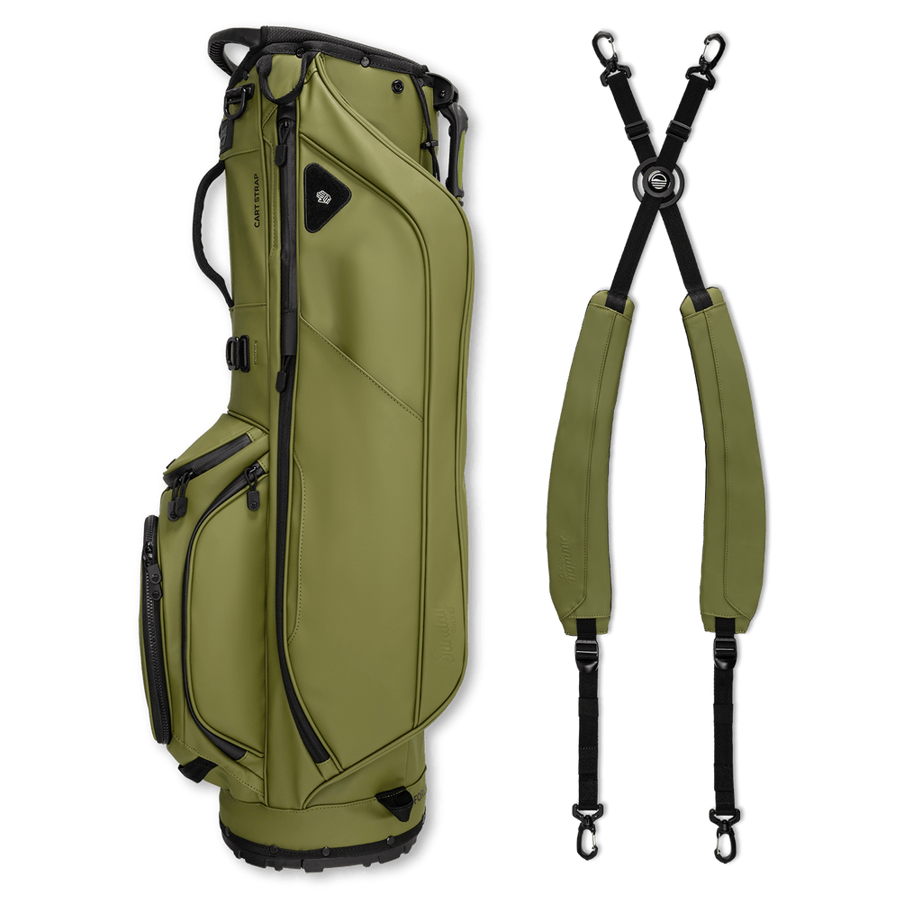 A full shot of Ryder S-Class golf bag in olive vegan leather laying flat sideways beside its double strap