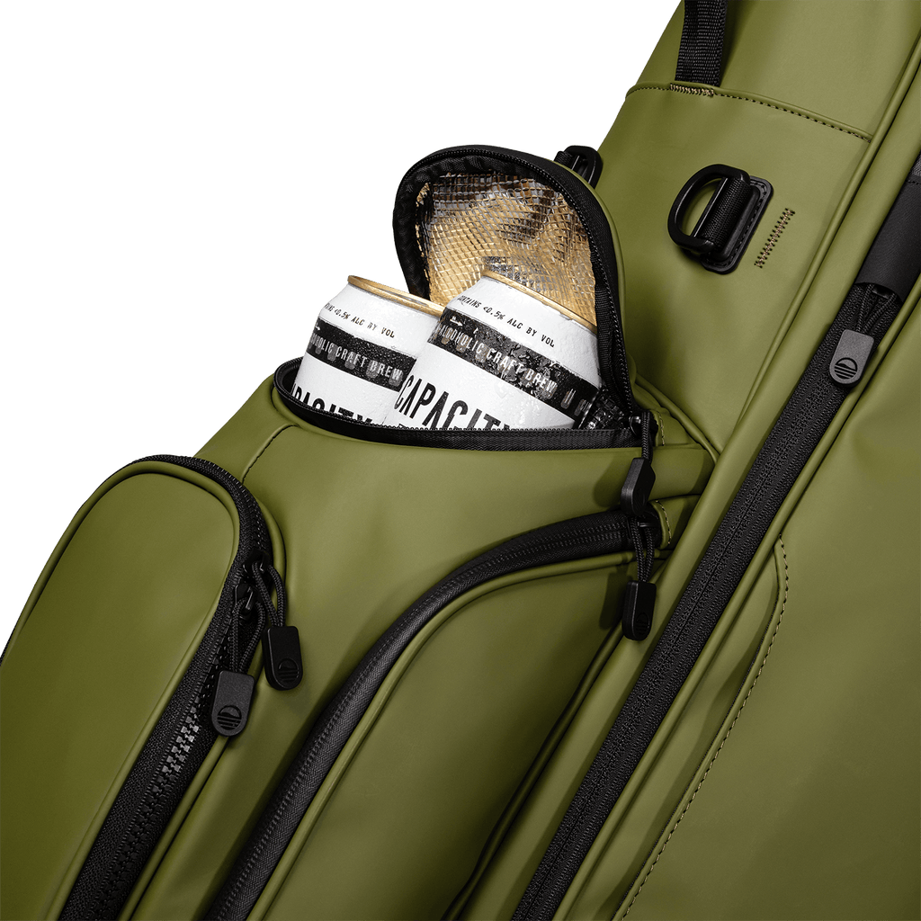 A close up shot of olive vegan leather Ryder S-Class golf bag's frosty pocket with canned drinks inside
