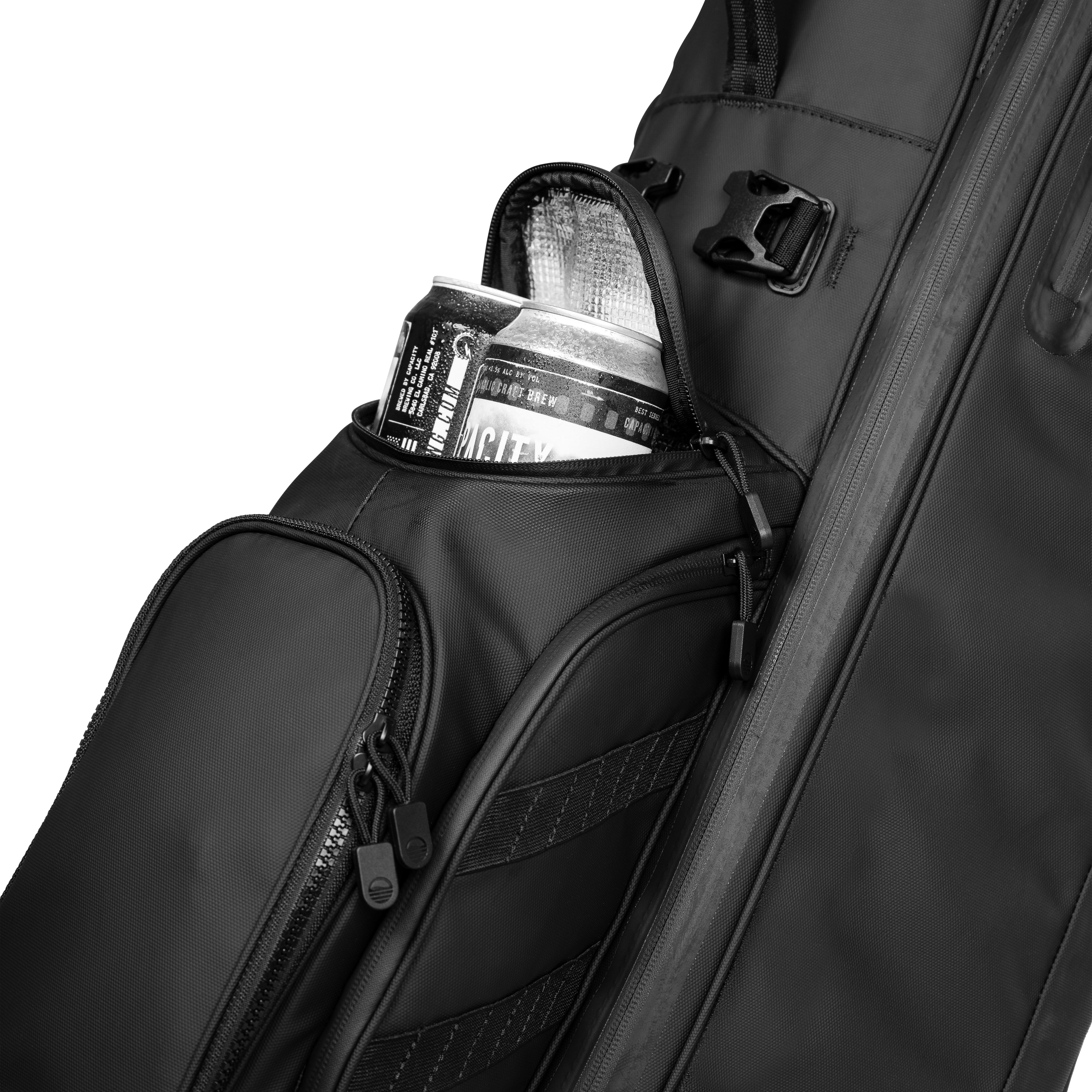 A close up shot of storm Ryder golf bag's frosty pocket with canned drinks inside
