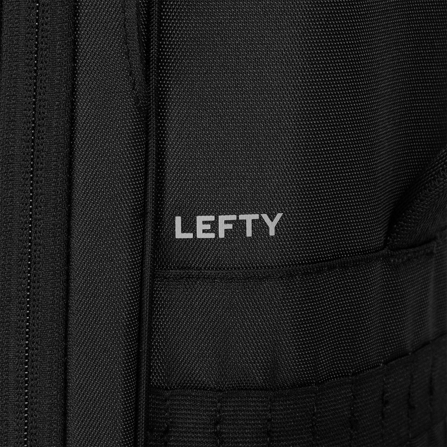 Close-up of a black backpack with 'LEFTY' branding.