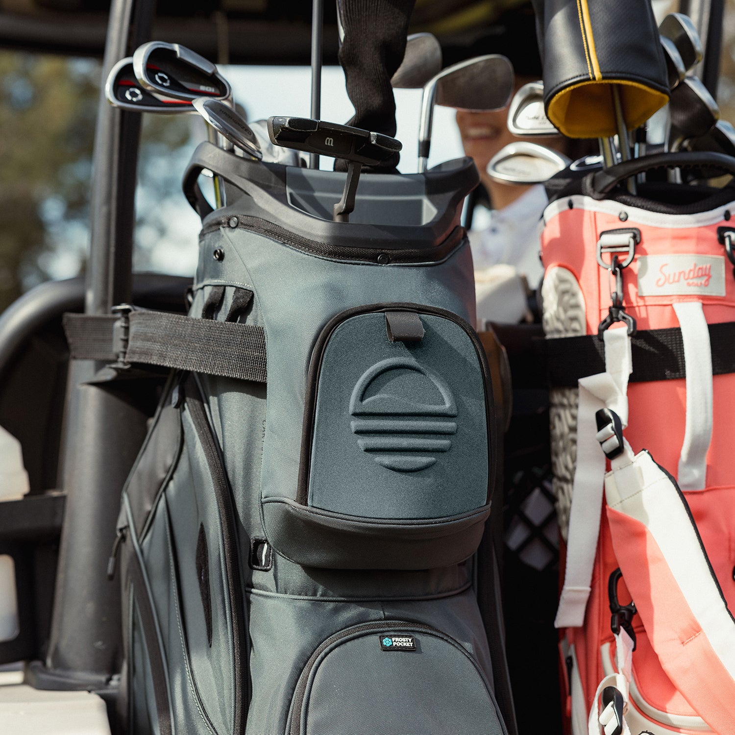A close up shot of Big Rig golf bag in heather green showing its front pockets