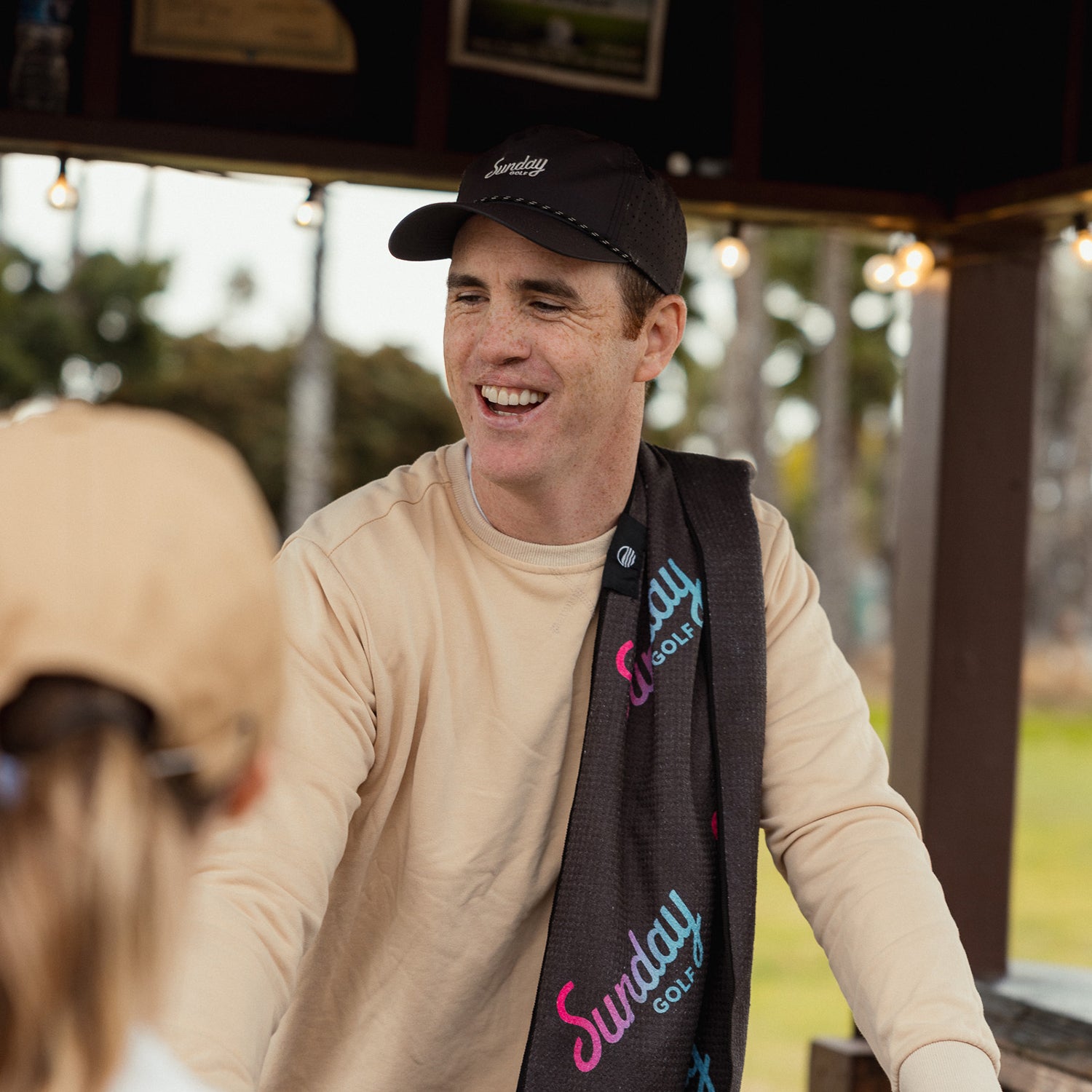 Ronan wearing black Porter Lite golf hat