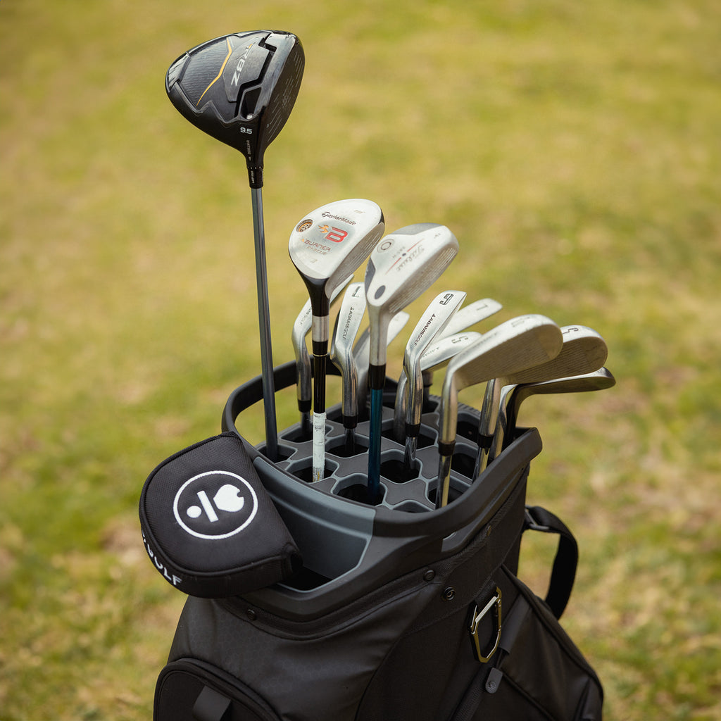 Golf clubs inside a matte black Big Rig golf bag