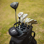 Golf clubs inside a matte black Big Rig golf bag