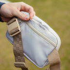 A close up shot of toasted almond belt bag