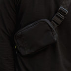 Close up shot of women's belt bag in black when worn