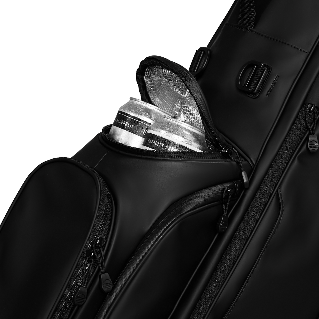 A close up shot of black vegan leather Ryder S-Class golf bag's frosty pocket with canned drinks inside