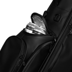 A close up shot of black vegan leather Ryder S-Class golf bag's frosty pocket with canned drinks inside