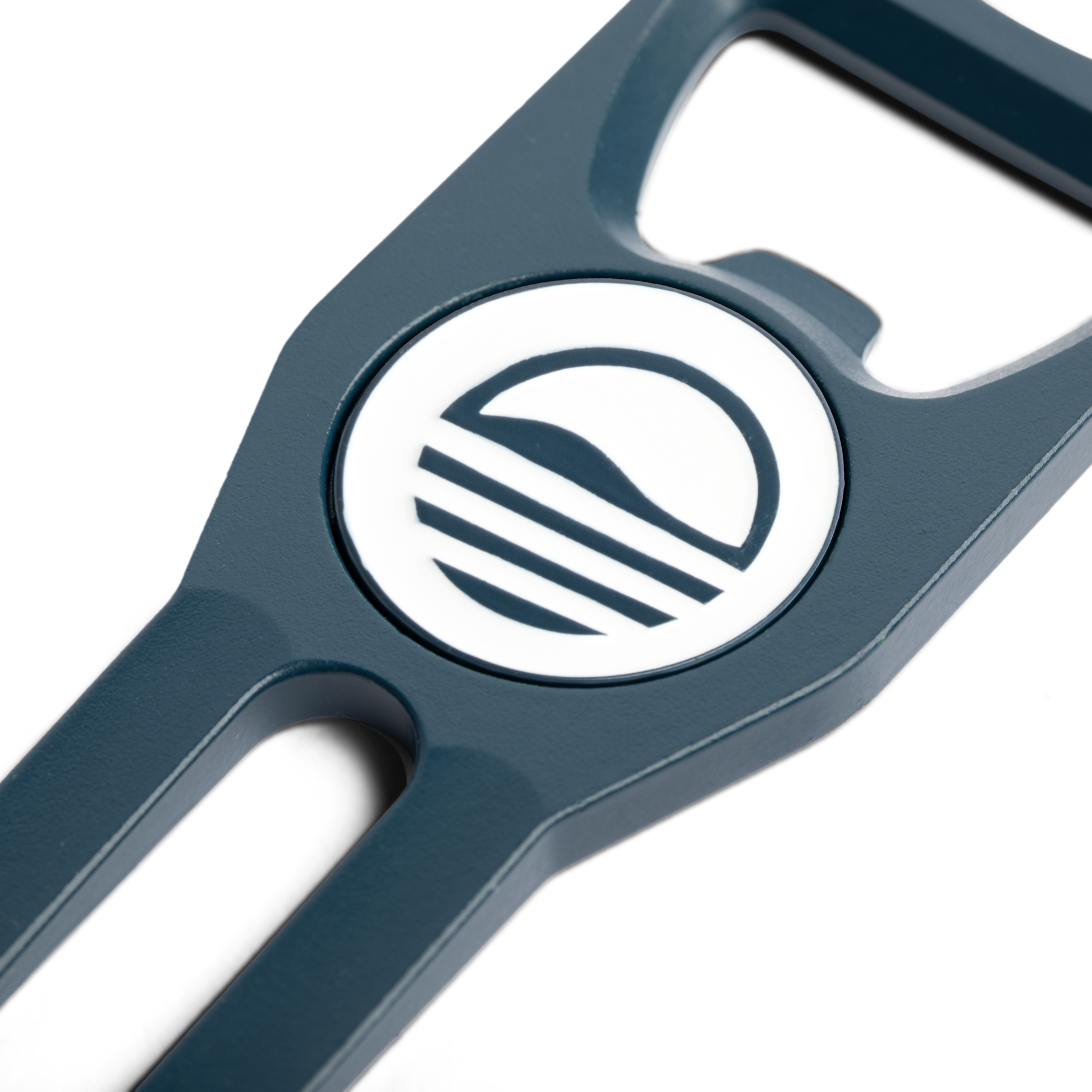 Teal Divot Tool with Sunday Golf sun logo close up shot