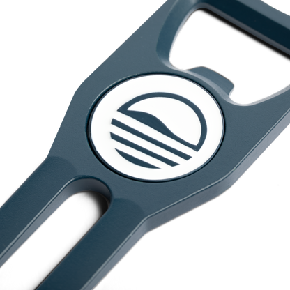 Teal Divot Tool with Sunday Golf sun logo close up shot