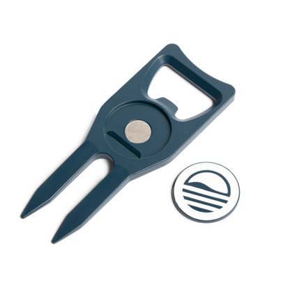 Teal Divot Tool with Sunday Golf sun logo and ball marker off and placed on the side showing the magnet inside. 