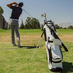 A full view shot of Ryder S-Class in vegan white leather with a guy swinging on the background