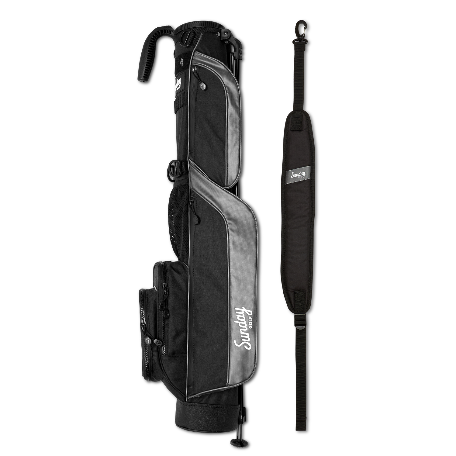 A full shot of Loma golf bag in matte black laying flat sideways beside its single strap