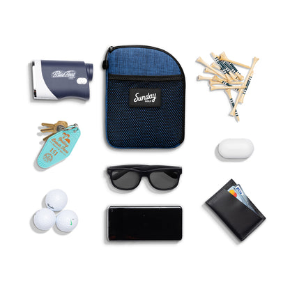 Cobalt blue nickel bag valuables pouch laying flat with items it can hold 