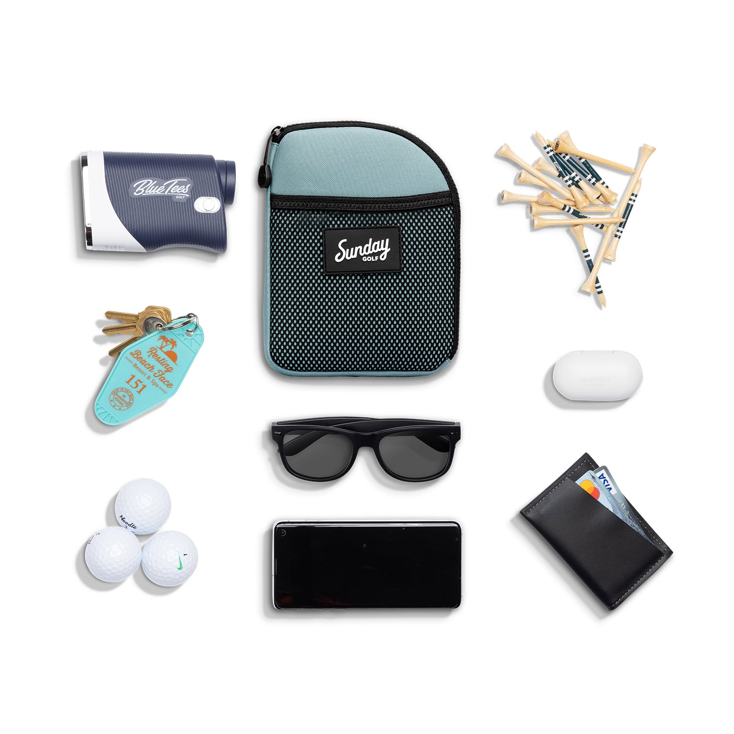 Seafoam green nickel bag valuables pouch laying flat with items it can hold 