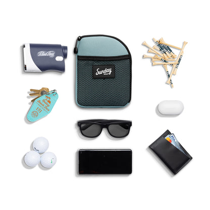 Seafoam green nickel bag valuables pouch laying flat with items it can hold 