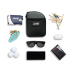 Midnight green nickel bag valuables pouch laying flat with items it can hold 