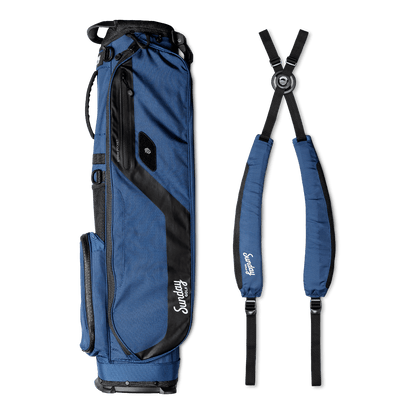 A full shot of El Camino golf bag in cobalt blue laying flat sideways beside its matching double strap