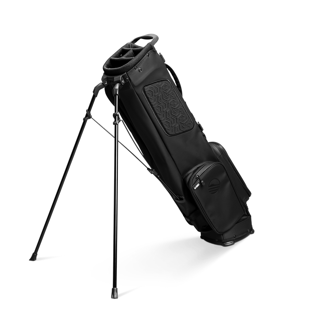 A full shot of El Camino S-Class golf bag in black vegan leather material facing backward with a stand