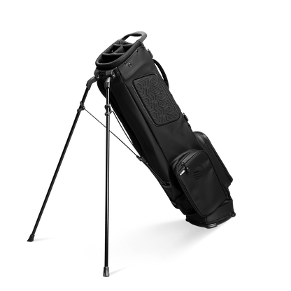 A full shot of El Camino S-Class golf bag in black vegan leather material facing backward with a stand