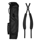 El Camino S-Class golf bag in black vegan leather material laying flat sideways beside a double strap