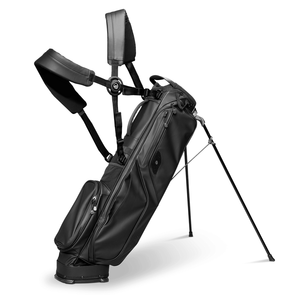 A full shot of standing El Camino S-Class golf bag in black vegan leather material with double strap