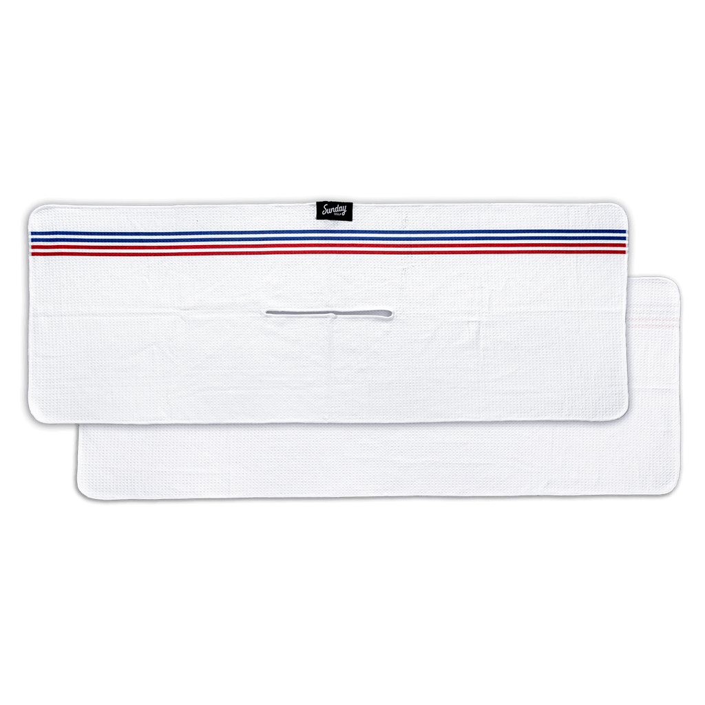 white El Classico golf towel by Sunday Golf with red and blue pinstripe across top horizontal 