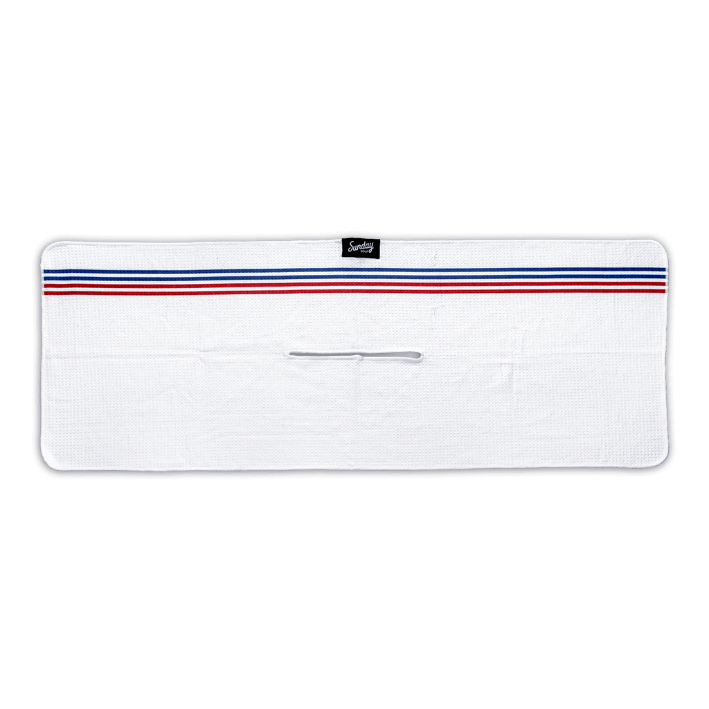 El Classico golf towel by Sunday golf white golf towel with red and blue pinstripes 