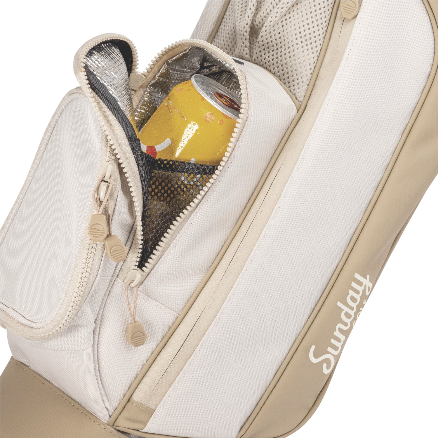 A close up shot of toasted almond Loma golf bag's insulated pocket with a canned drink inside