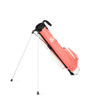 A full shot of standing Loma golf bag in coral facing backward