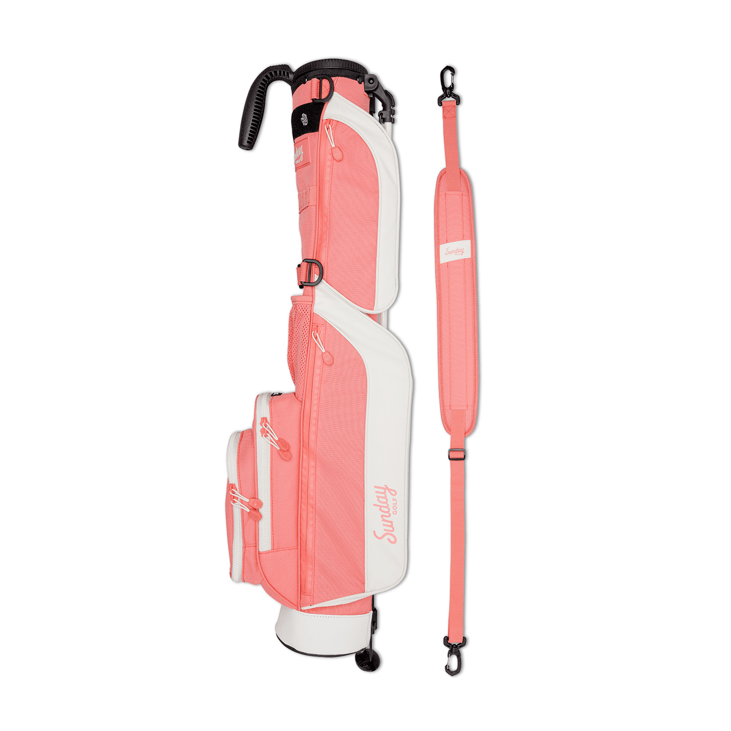 A full shot of Loma golf bag in coral laying flat sideways beside its single strap