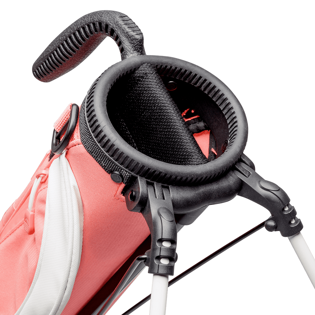 A close up top view of a coral Loma golf bag’s 2-way divider