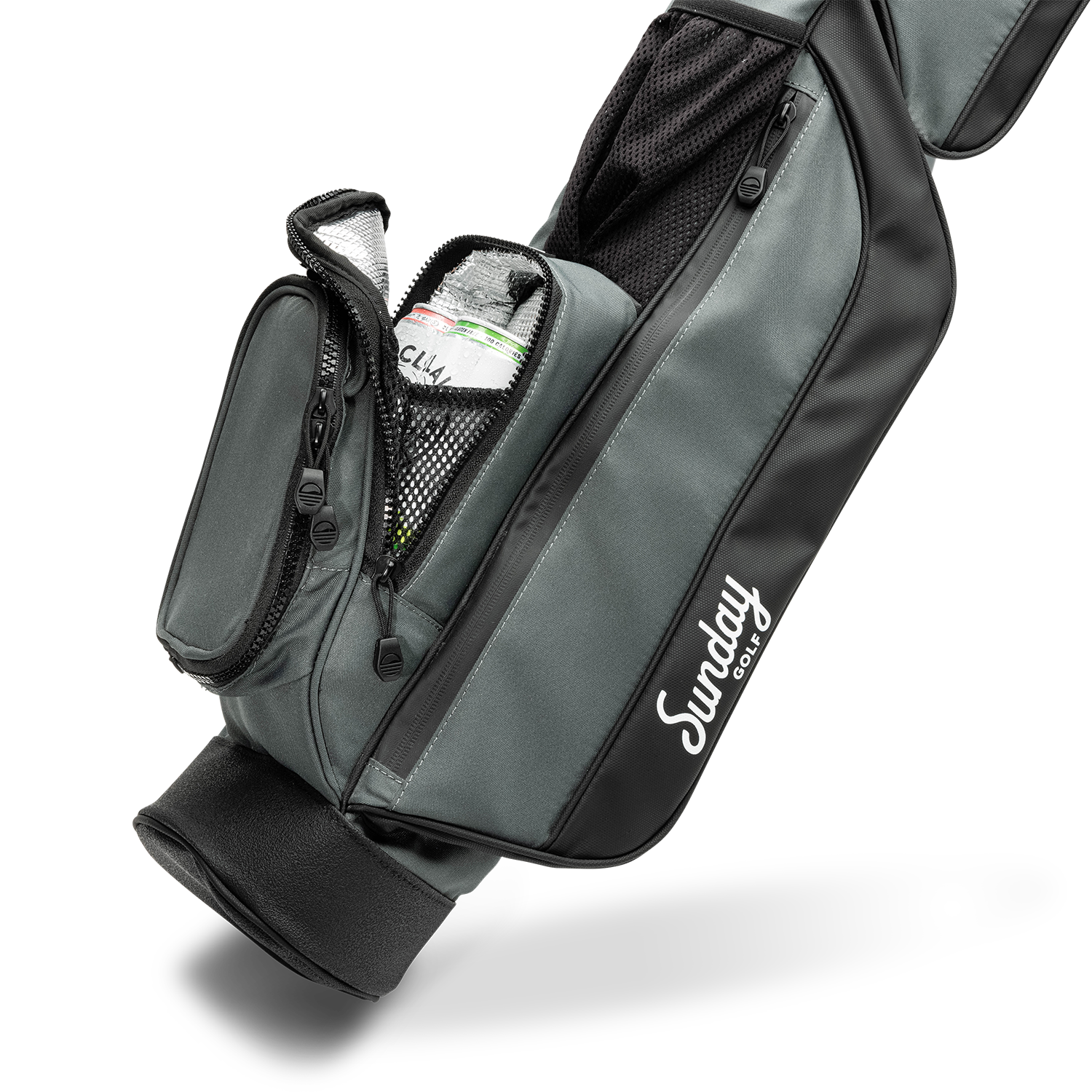 A close up shot of midnight green leather Loma golf bag's insulated pocket with canned drinks inside