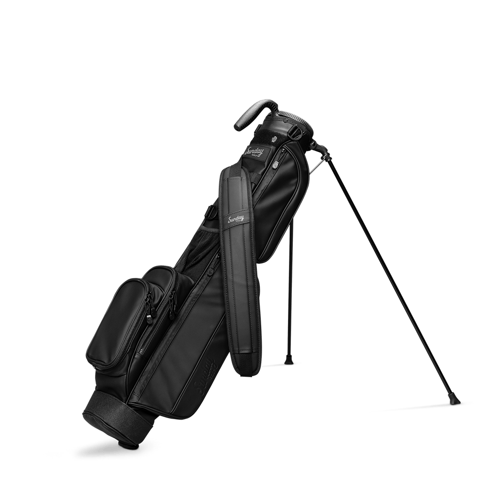 A full front shot of standing Loma S-Class golf bag in black vegan leather with double strap