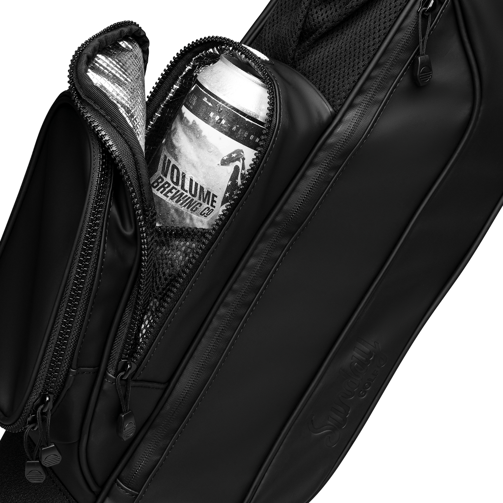 A close up shot of black vegan leather Loma S-Class golf bag's frosty pocket with a canned drink inside