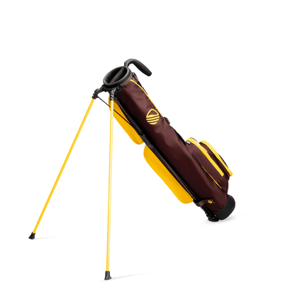 A full shot of standing Loma golf bag in friars brown facing backward