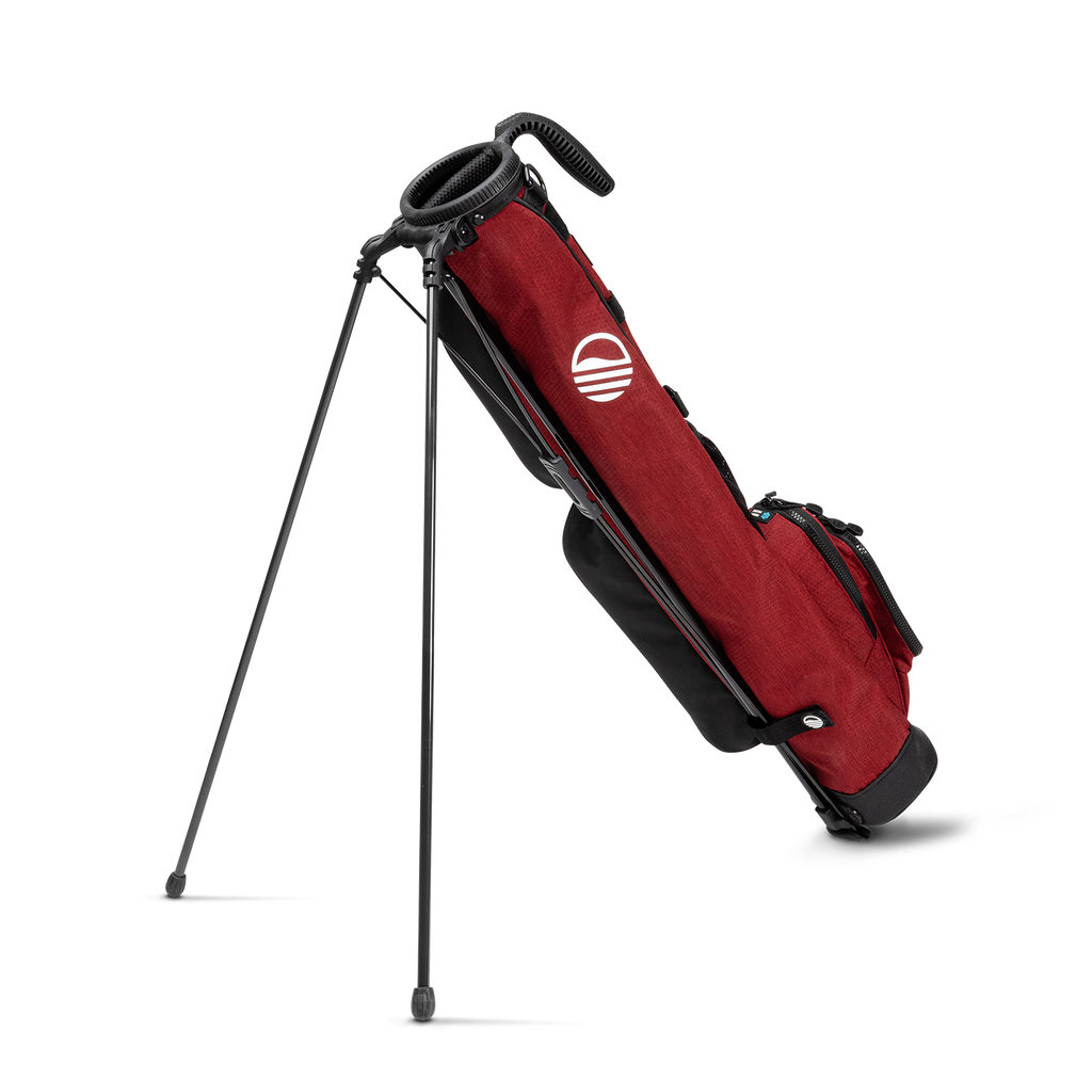 A full shot of standing Loma golf bag in ron burgundy facing backward
