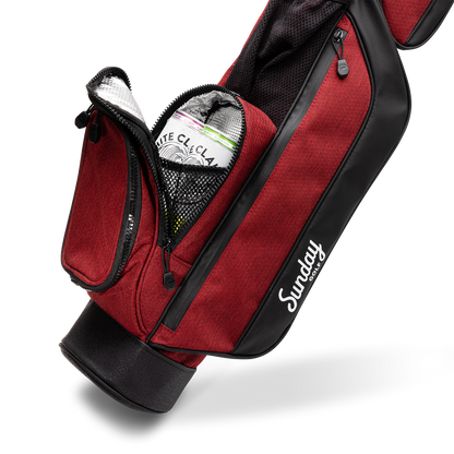 A close up shot of ron burgundy Loma golf bag's insulated pocket with canned drinks inside
