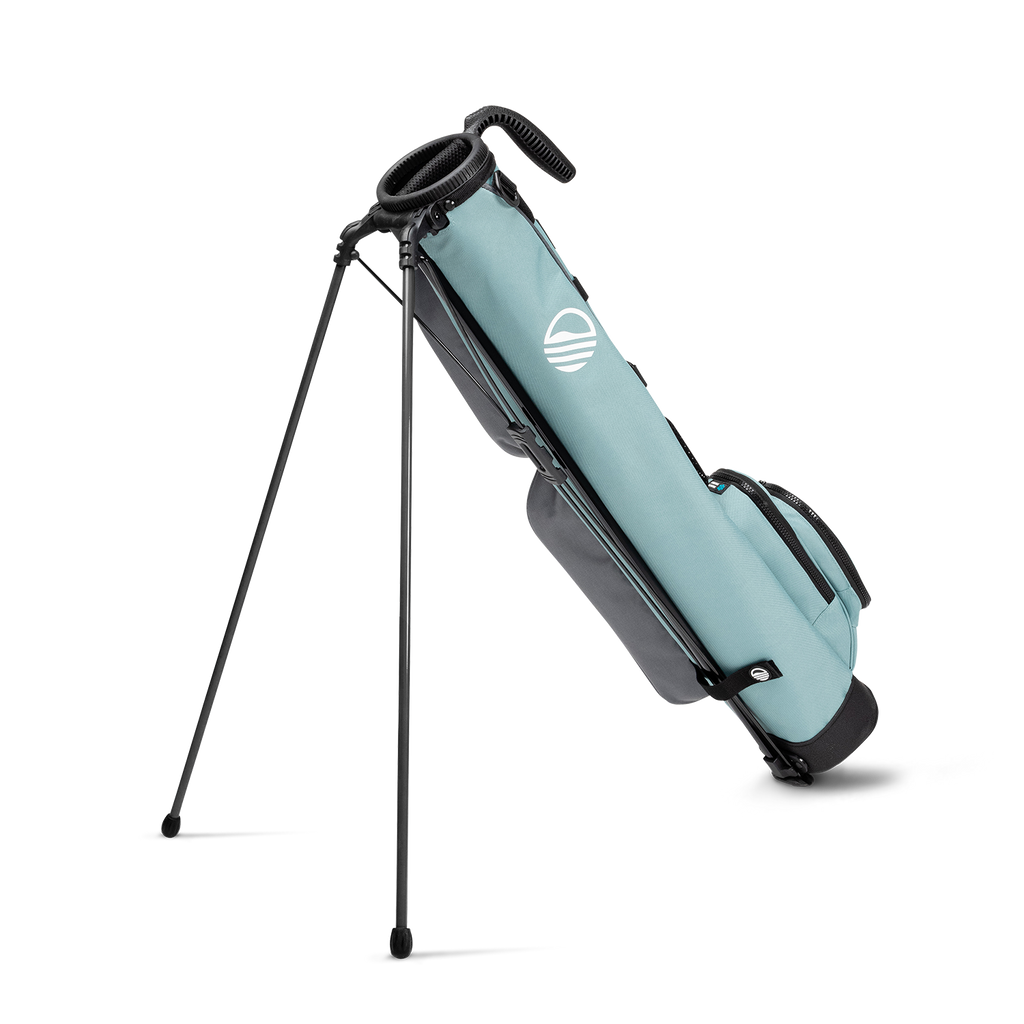 A full shot of standing Loma golf bag in seafoam facing backward